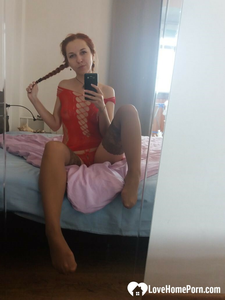 Smoking redhead teases in stockings in the bedroom — 17