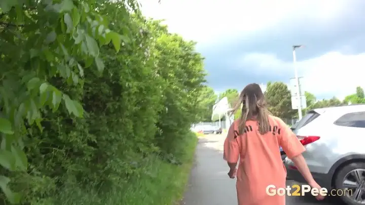 Naomi Benet pulls her panties aside and sprays a long stream of piss onto the ground. — 14