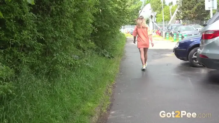 Naomi Benet pulls her panties aside and sprays a long stream of piss onto the ground. — 15